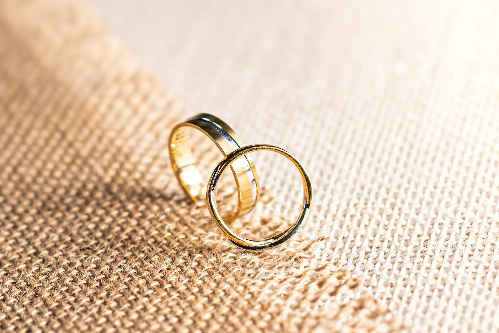 silver ring on brown textile